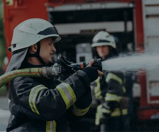 A firefighter holding a water hose